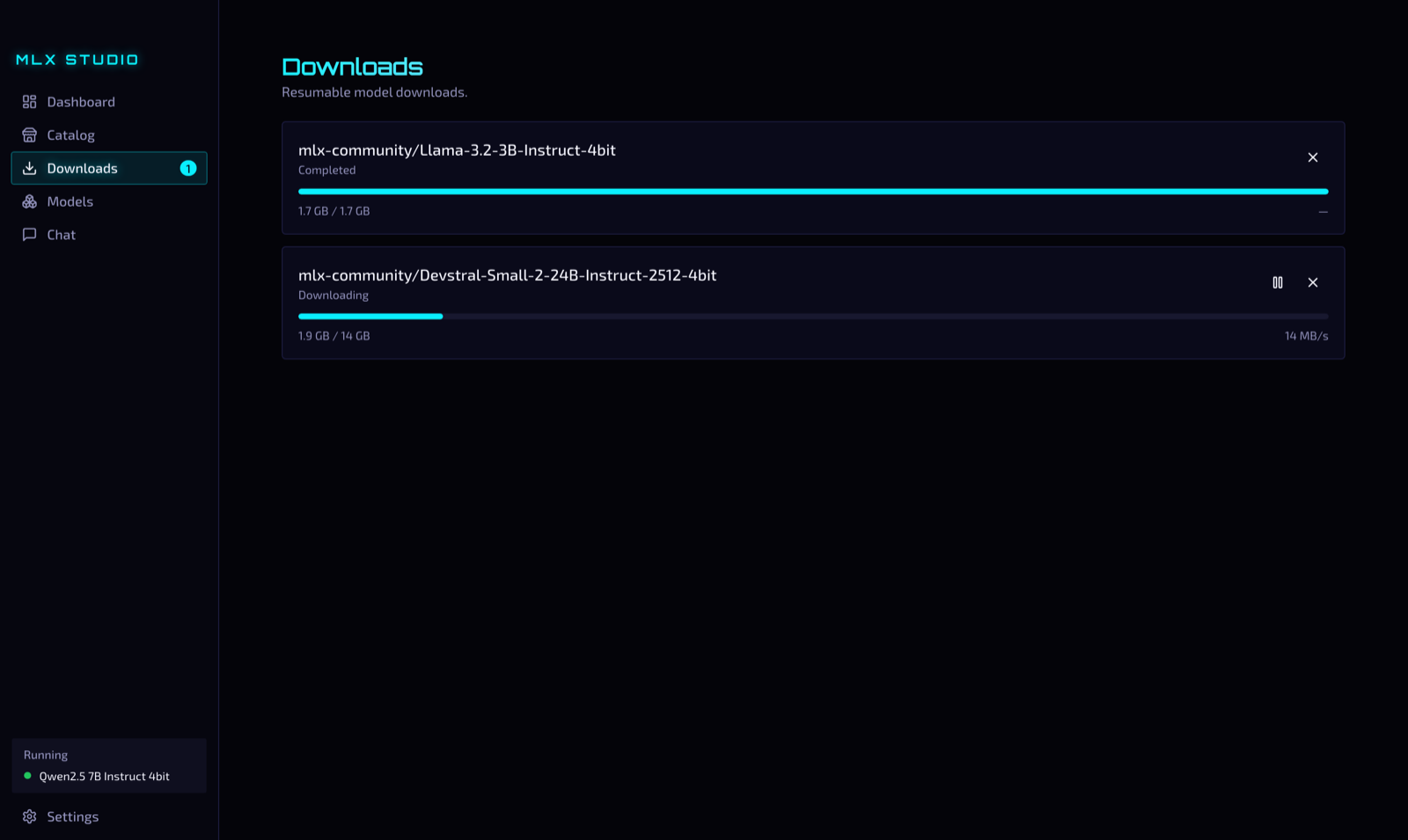Downloads view with a completed model and one downloading at 14 MB/s